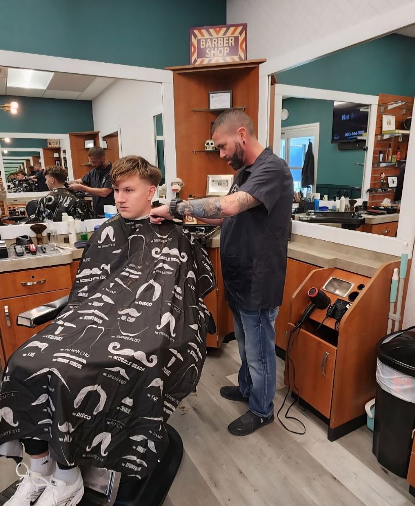 A barber at work in Brotherton Barbershop