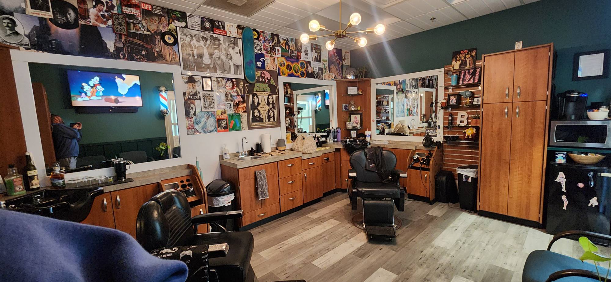 Inside Brotherton Barbershop, walls covered in records and posters
